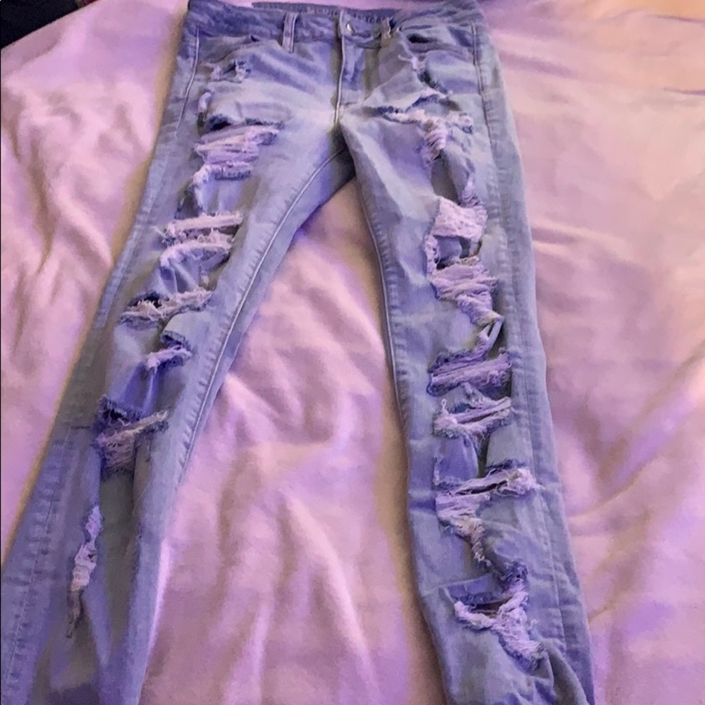 Light wash jeans with rips on front and back